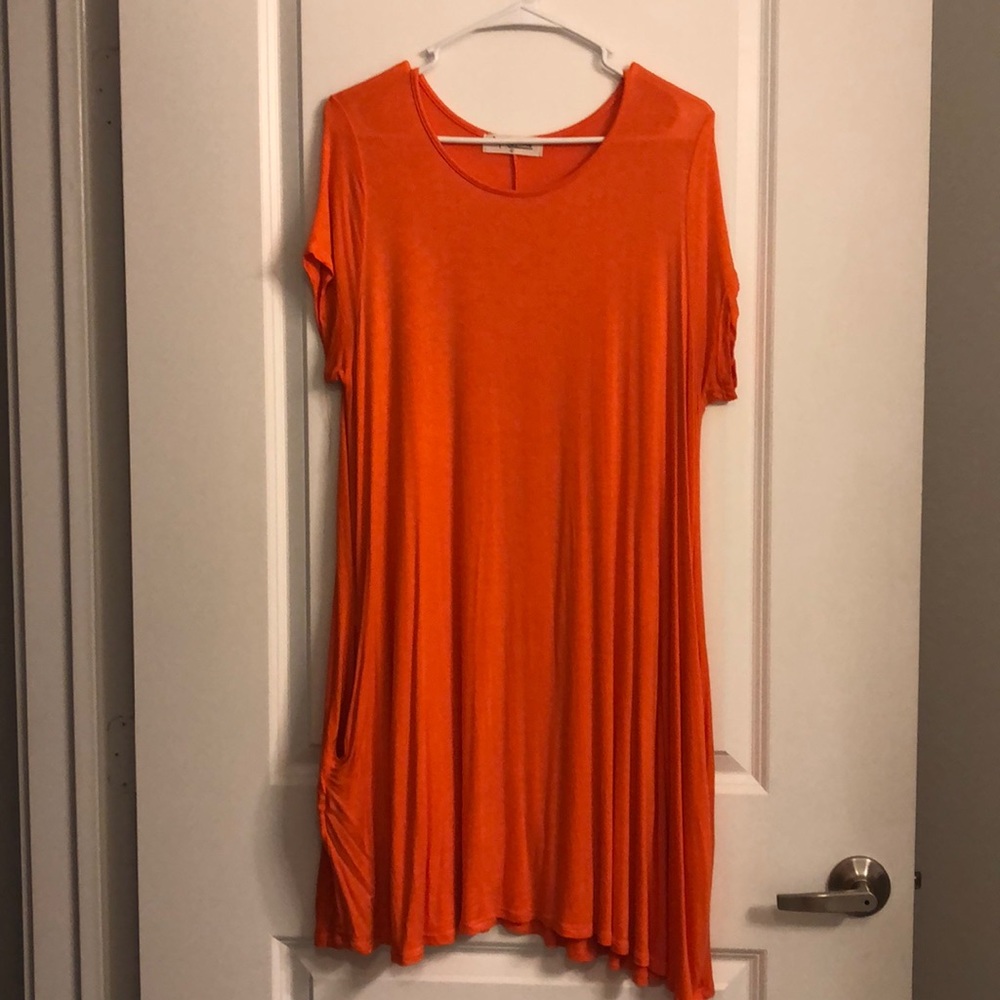 Bright orange knee length dress
